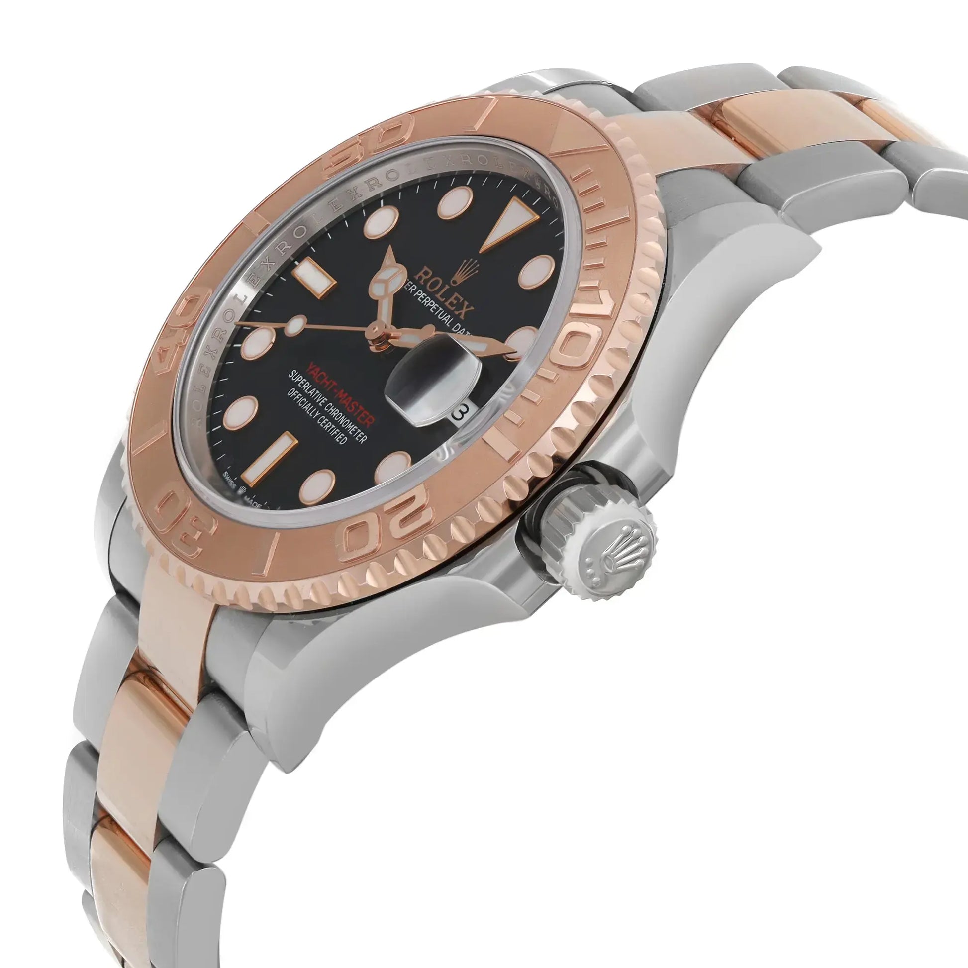 An image of a pre-owned men's Rolex wristwatch in a side profile view with the crown visible. The watch is at a close distance, angled to showcase the rose gold bezel with embossed 60-minute markers and a black dial featuring a date indicator at 3 o'clock, and luminous hands and hour markers. The stainless steel and rose gold bracelet gently curves away from the watch face. Light signs of wear and scratches are visible on the surfaces.