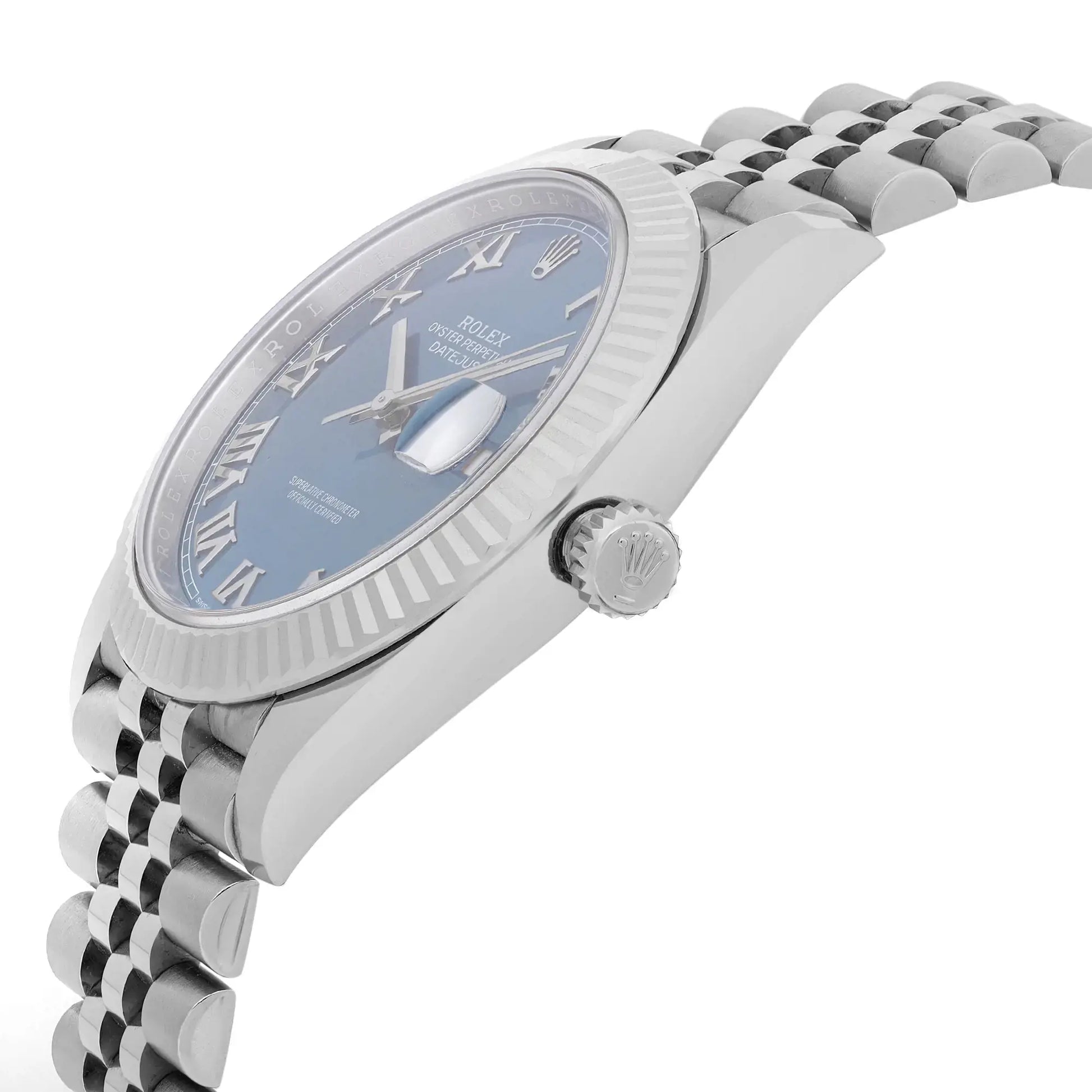 An image of a new Rolex men's luxury wristwatch with a side profile view showing the crown. The watch features a round shape with a blue dial and a white gold bezel. It has a date indicator and is made of stainless steel, both the case and the band. The watch is photographed from a close distance, focusing on the side angle to highlight the crown and the curvature of the bezel.